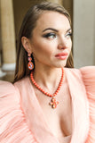 Orange coral necklace with a floral pendant featuring orange crystals in silver – part of the Paradise Floral collection by Sildare Jewelry.