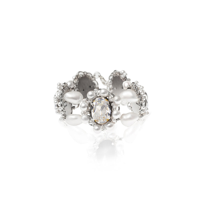 SILDARE Jewelry a silver-tone baroque pearl and crystal bracelet with a intricate design, featuring a central pearl surrounded by crystal accents.