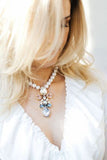SILDARE Jewelry a Baroque style handmade necklace with a gold-plated pendant featuring white pearls and Austrian crystals.
