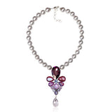 SILDARE-Jewelry a Baroque style necklace with a silver chain and a pendant featuring a combination of purple and clear crystals, along with a pearl.