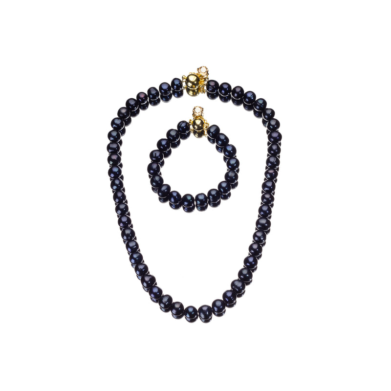 A matching pearl necklace and bracelet set with dark navy blue baroque pearls and gold-toned clasp details, displayed on a clean white background.