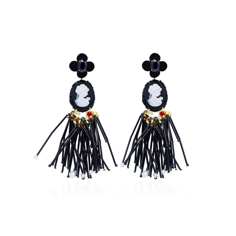 A pair of black and white cameo and pearls-style Sildare Jewelry drop  earrings with floral details and long dangling black strands, shown on a plain white background. Avan-garde-style handmade earrings