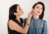 Luxury gold‑tone white floral earrings with high‑precision Austrian crystals — perfect for weddings, evening events, bridal elegance, and refined classic old‑money style; handcrafted one‑of‑a‑kind jewelry by SILDARE Jewelry