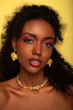 Yellow crystal statement necklace with silver‑plated finish, worn as an elegant accessory for refined, expressive style; handcrafted one‑of‑a‑kind jewelry by SILDARE Jewelry