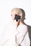 SILDARE Jewelry black floral statement ring with sculptural petals, iridescent crystal accents and gold‑tone band — perfect for weddings, special events, fine‑dining evenings and luxury galas; handcrafted one‑of‑a‑kind design.