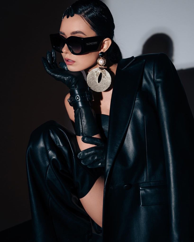Luxury gold‑tone black statement HÉRITAGE earrings with sculptural contours, Austrian crystals, pearls, and natural leather detailing — quiet radiance, modern artistic elegance, intimate poetic presence; perfect for refined occasions, evening looks, gallery events, and elevated daytime style; handcrafted one‑of‑a‑kind jewelry by SILDARE Jewelry