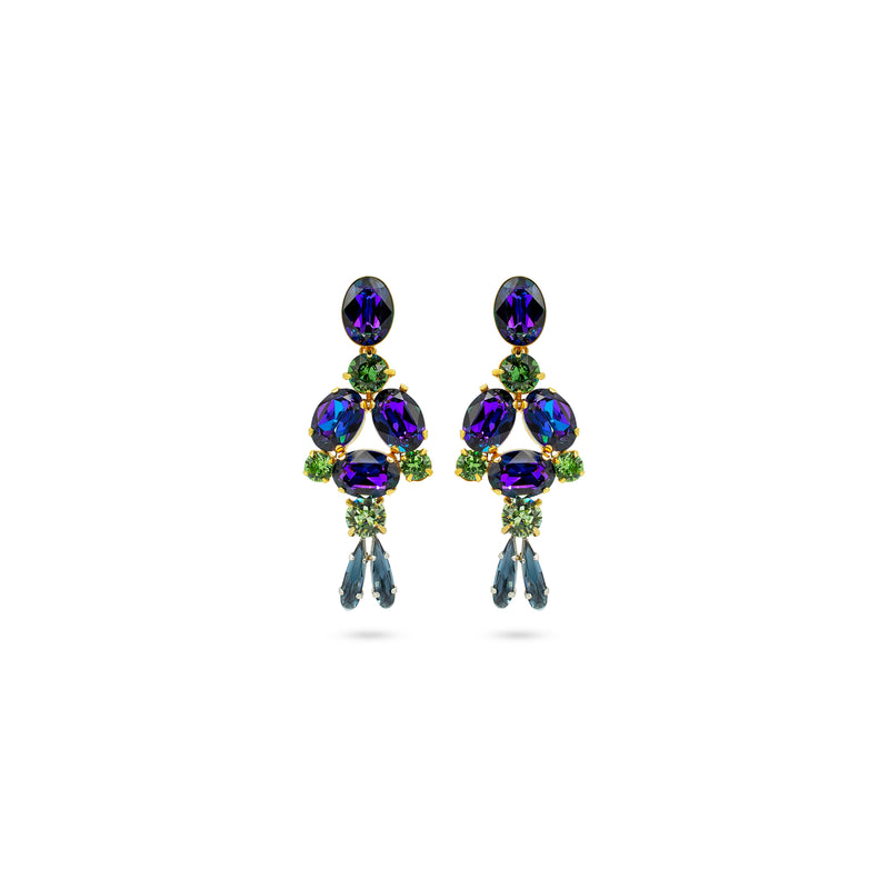 A pair of gold-plated dangle earrings featuring oval and marquise-cut iridescent purple crystals, accented with green crystals and finished with dangling blue teardrop crystals, shown on a plain white background.