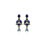 A pair of gold-plated dangle earrings featuring oval and marquise-cut iridescent purple crystals, accented with green crystals and finished with dangling blue teardrop crystals, shown on a plain white background.