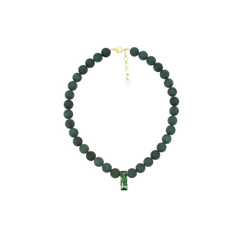 A beaded necklace made of dark green round beads with a small green rectangular pendant and gold-tone clasp, shown on a plain white background.