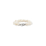 A multi-strand pearl bracelet with a polished silver lobster clasp, displayed on a clean white background.