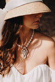 Luxury white pearl gold‑plated statement necklace with Austrian crystals and pearls — perfect for weddings, evening events, bridal elegance, and refined classic old‑money style; handcrafted one‑of‑a‑kind jewelry by SILDARE Jewelry