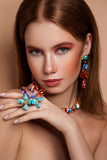 Luxury gold‑tone colorful crystal statement earrings with high‑precision Austrian crystals — minimalist sculptural design; handcrafted one‑of‑a‑kind jewelry by SILDARE Jewelry, vibrant statement earrings for refined feminine style