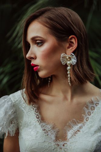 Elegant bridal statement earrings with pearls and clear Austrian crystals in floral design, gold-plated finish. Perfect for weddings or formal occasions - Sildare Jewelry