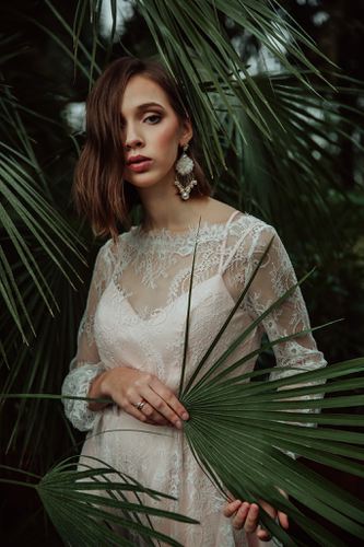 Elegant bridal statement earrings with pearls and clear Austrian crystals in floral design, gold-plated finish. Perfect for weddings or formal occasions - Sildare Jewelry