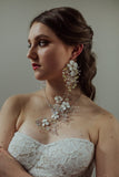 Elegant bridal statement earrings with clear Austrian crystals in floral design, silver finish. Perfect for weddings or formal occasions - Sildare Jewelry