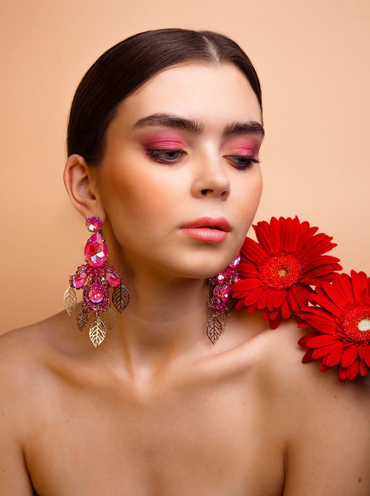 Malvie magazine Paris. Bold floral statement earrings crafted with Pink Austrian crystals and silver plated finish. Inspired by blooming paradise gardens.
Handcrafted luxury jewelry by Sildare