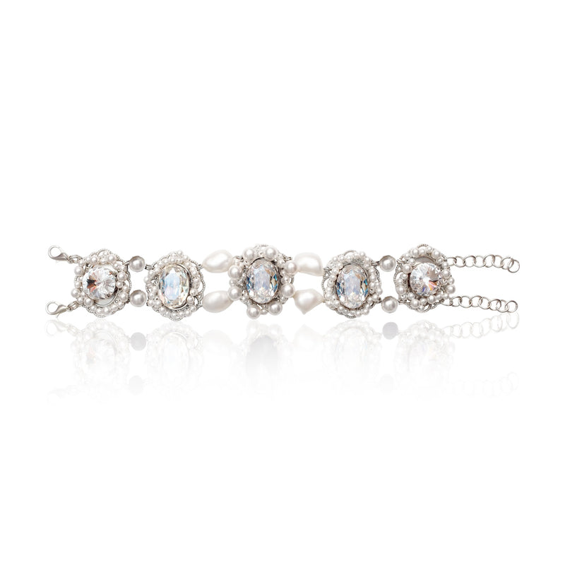 SILDARE Jewelry a silver-tone baroque pearl and crystal bracelet with a intricate design, featuring a central pearl surrounded by crystal accents.