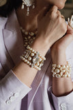 White Swarovski pearl gold tone bracelet