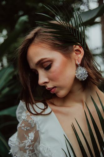 Elegant bridal statement earrings with clear Austrian crystals in floral design, silver finish. Perfect for weddings or formal occasions - Sildare Jewelry